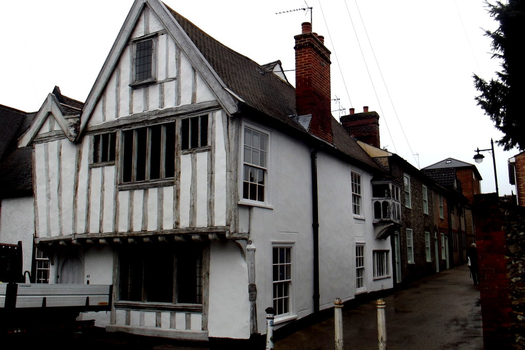 The early-14th-century timber-framed jettied ancient house at 61-63 Whiting Street, Bury St Edmunds, on the corner of College Lane, three doors from Burnett Barker's office at Collingwood House.